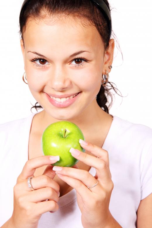 Free stock image of Girl with Green Apple created by Pixabay
