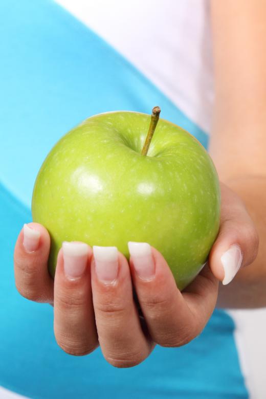 Free stock image of Holding an Apple created by Pixabay