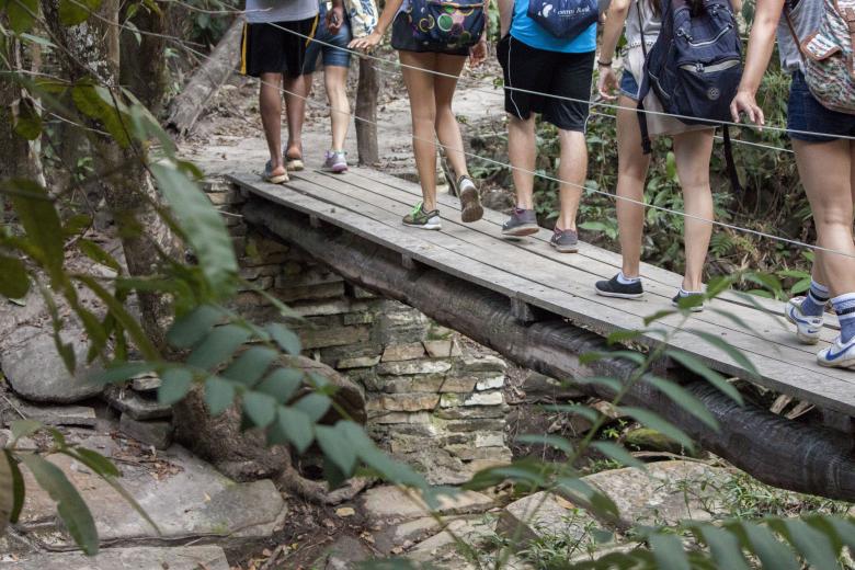 Free stock image of Backpackers Crossing a Small Bridge created by Eduardo Soares Bogosian