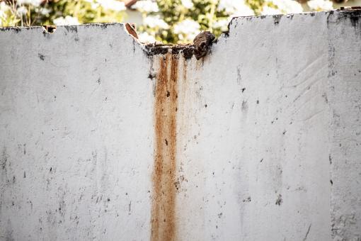 Rust Streaks on Old Concrete Wall