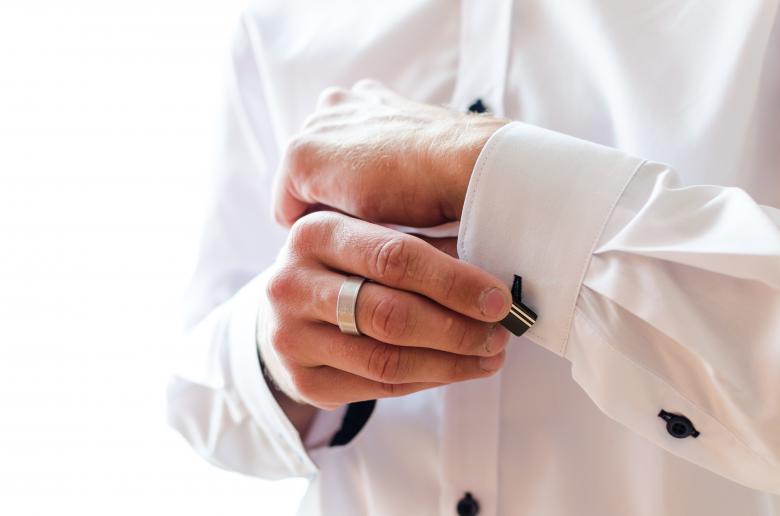 Free stock image of Buttoning His Shirt Sleeves created by Lukas