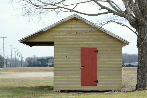 Wooden Shed with Red Door