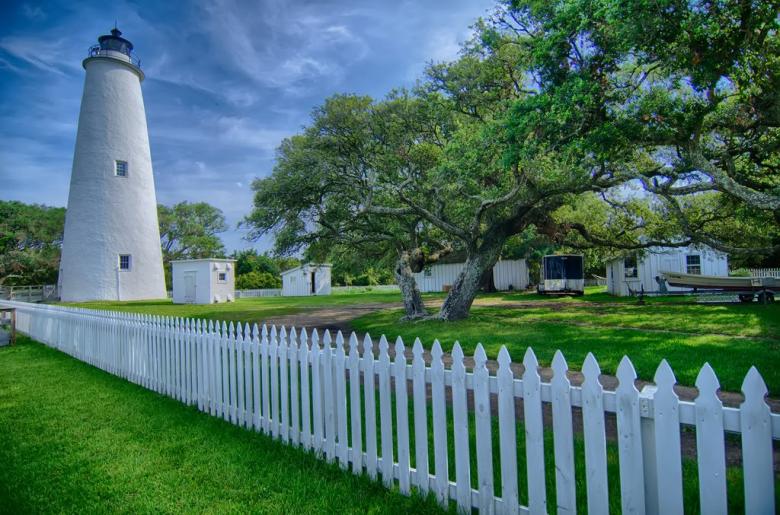 Free stock image of White Lighthouse and Garden created by agphotostock.com