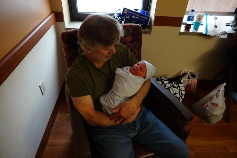 Free stock image of Pap holding new grandson created by rudy liggett