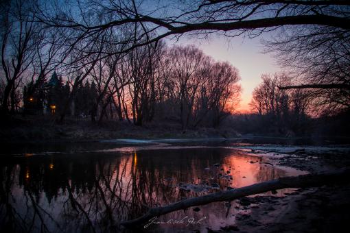 Sunset Over the Riverbanks