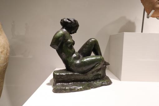 Free Stock Photo of Small bronze sculpture in a window
