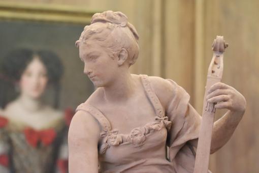 Free Stock Photo of Sculpture of young lady playing music