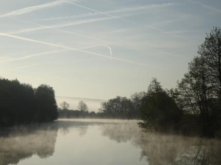 Free Stock Photo of Foggy river and smoke stripes in the sky