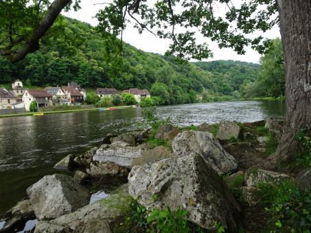 Free Stock Photo of View on a small village from the opposite river bank