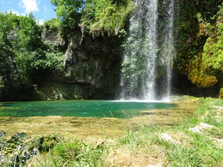 Free Stock Photo of Waterfall above a green pond