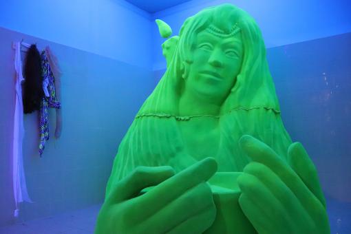 Free Stock Photo of Green sculpture on blue background