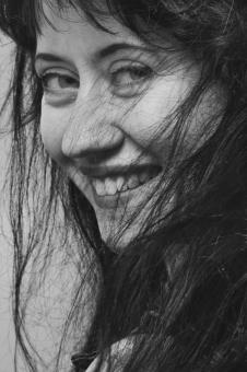 Smiling Girl with Dark Hair - Black and White - Free Stock Photo