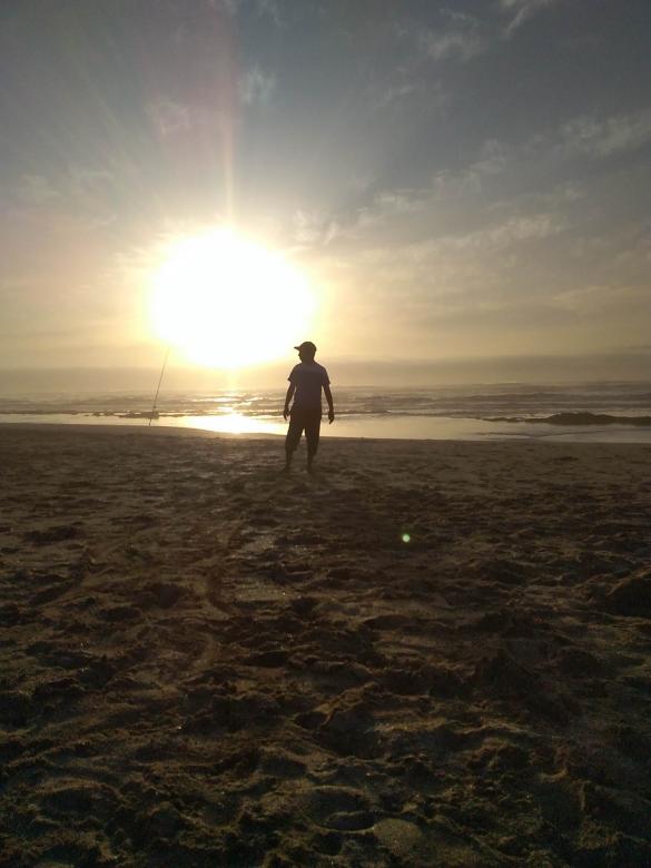 Free stock image of Man Standing on Beach - Silhouette created by Said Nouk