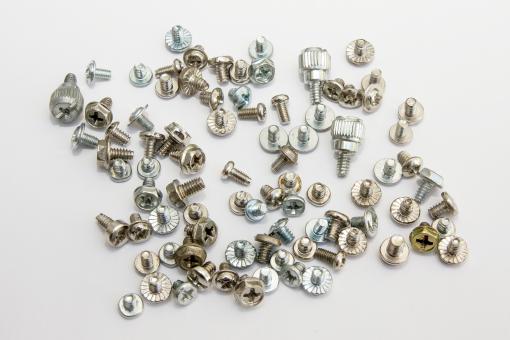Bolts strews with white background - Free Stock Photo