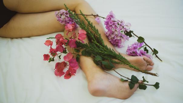 Woman Legs With Colorful Flowers