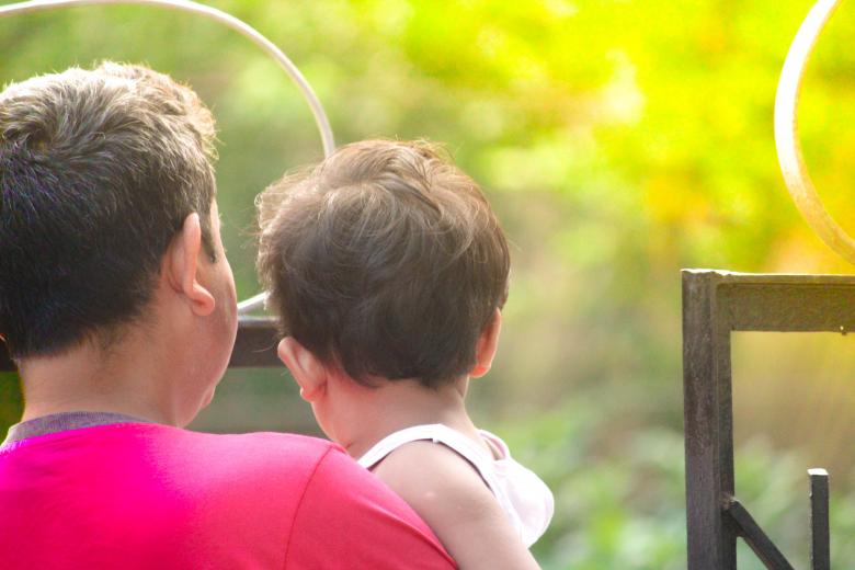 Free stock image of Man Holding a Child - Back View created by Moon  Bhuyan