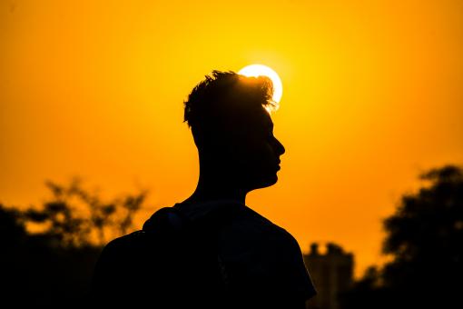 Silhouette of Man with Sun in Background - Free Stock Photo