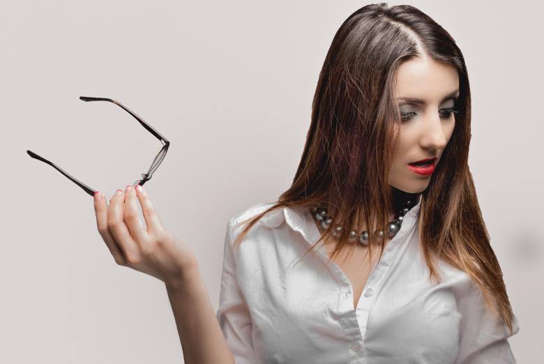 Free stock image of Girl Holding Glasses - Looking Down created by Alexander Krivitskiy
