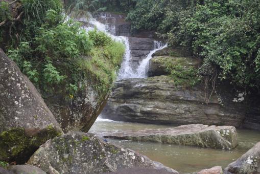 water falls down from rocks