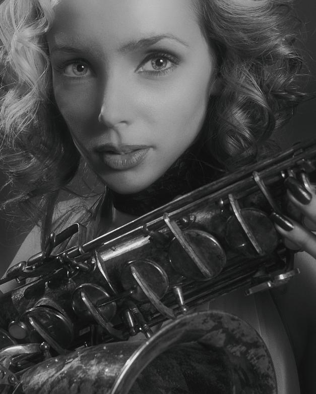 Free stock image of Sax player created by Alexander Krivitskiy