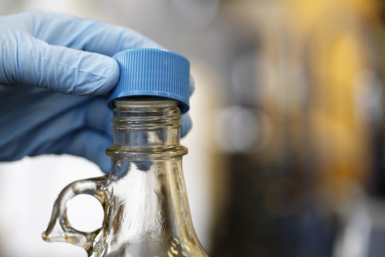 Free stock image of Fingers removing  cap from chemical bottle created by Geoffrey Whiteway
