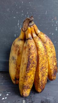 A banana with a close-up, against a black background, A banana f