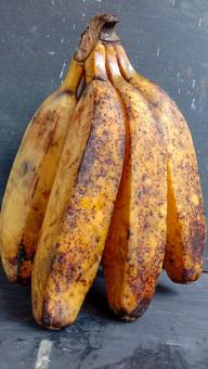 A banana with a close-up, against a black background, A banana f