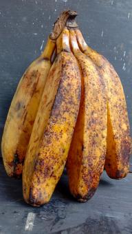 A banana with a close-up, against a black background, A banana f